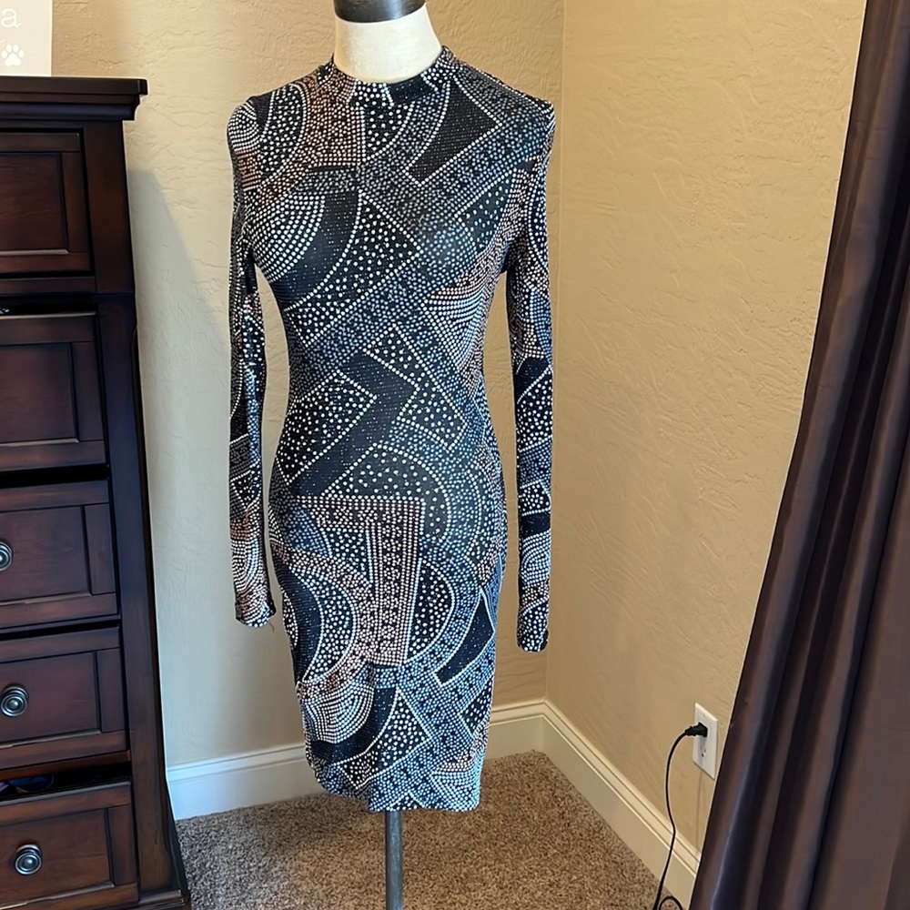 Black long sleeve fitted dress. Size small. Never worn